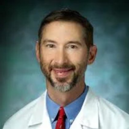 Dr. John E. Tis