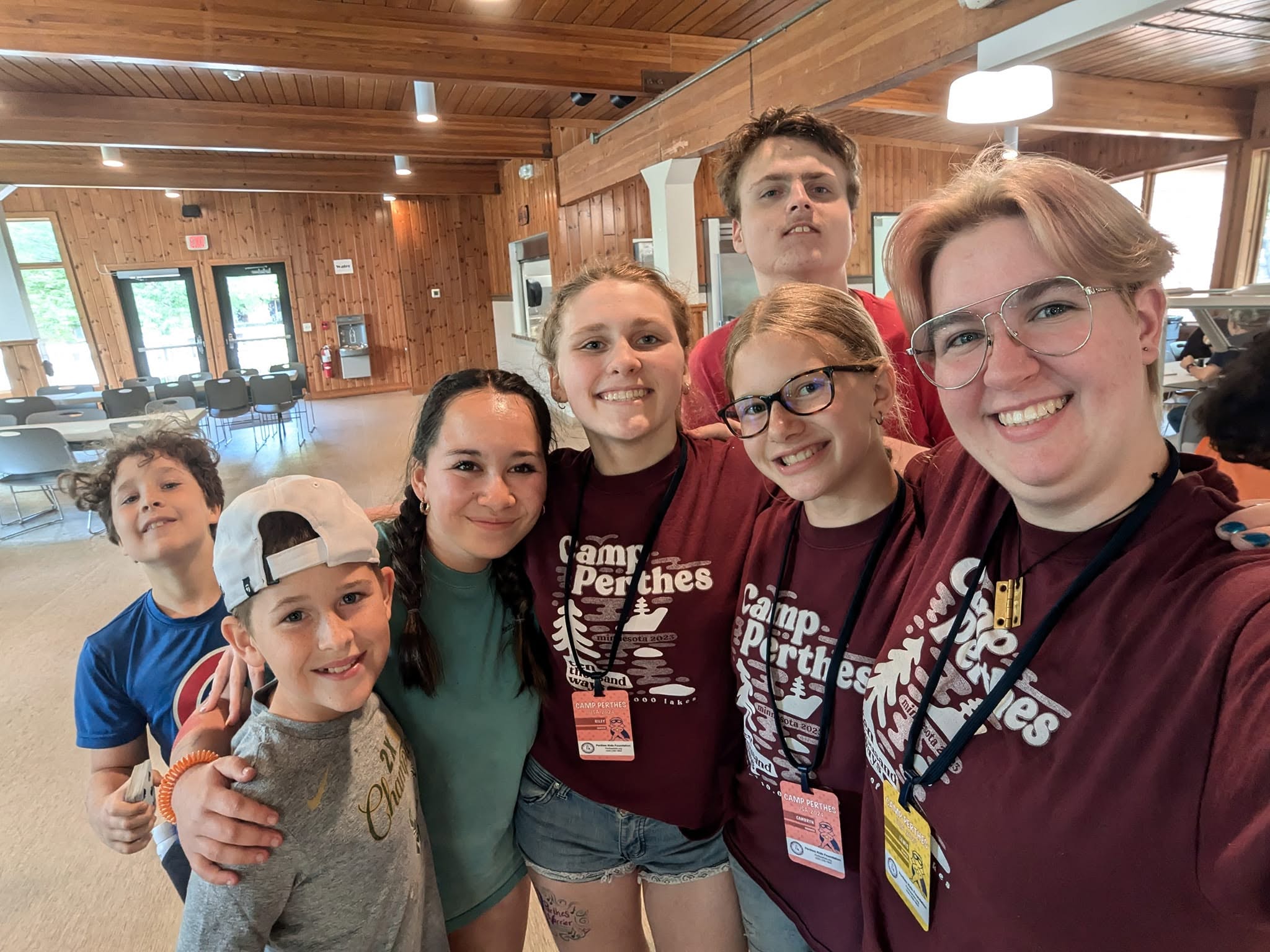 Campers and volunteers hugging at Camp Perthes